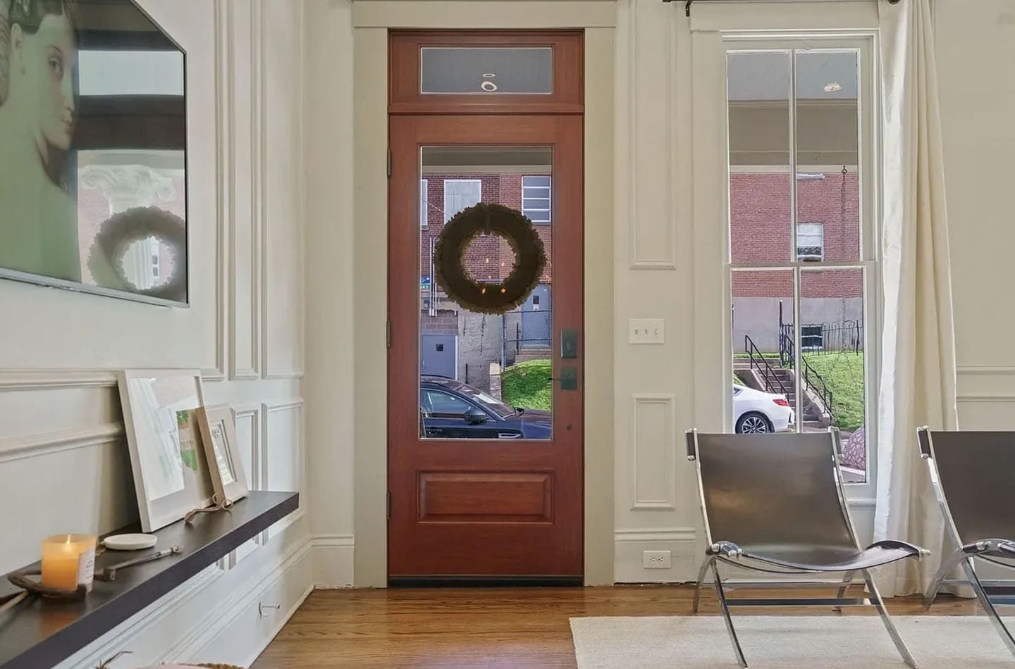 A door with a wreath on the front of it.