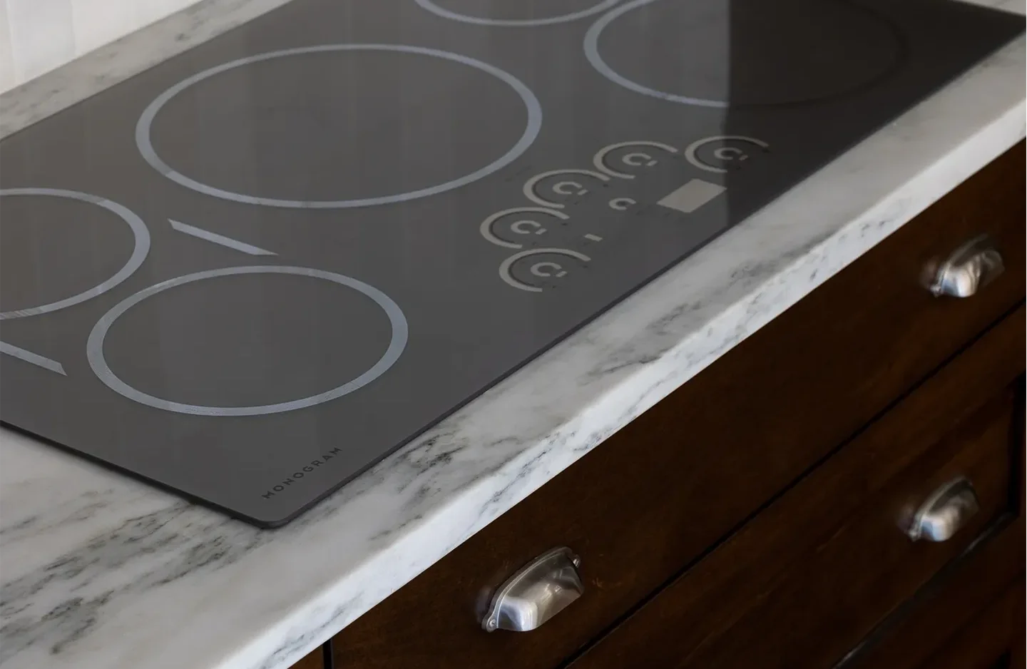 A close up of the top of an electric stove.