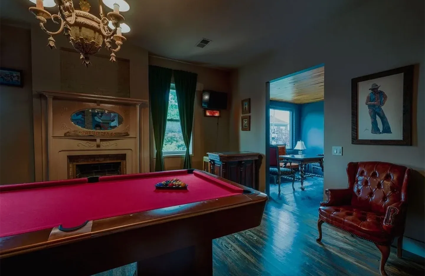 A pool table in the middle of a room.