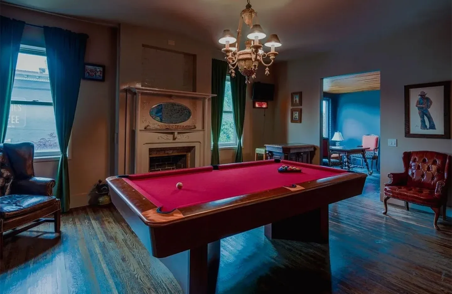 A pool table in the middle of a room.