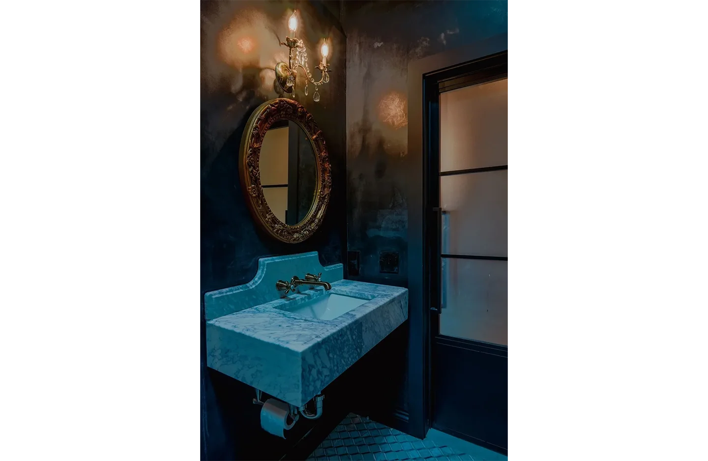 A bathroom with a sink and mirror in it