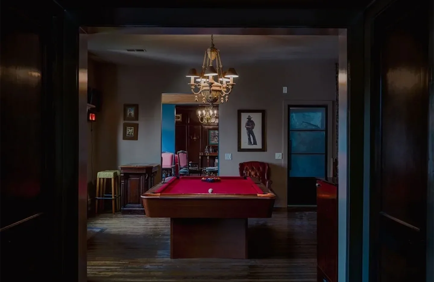 A pool table in the middle of a room.