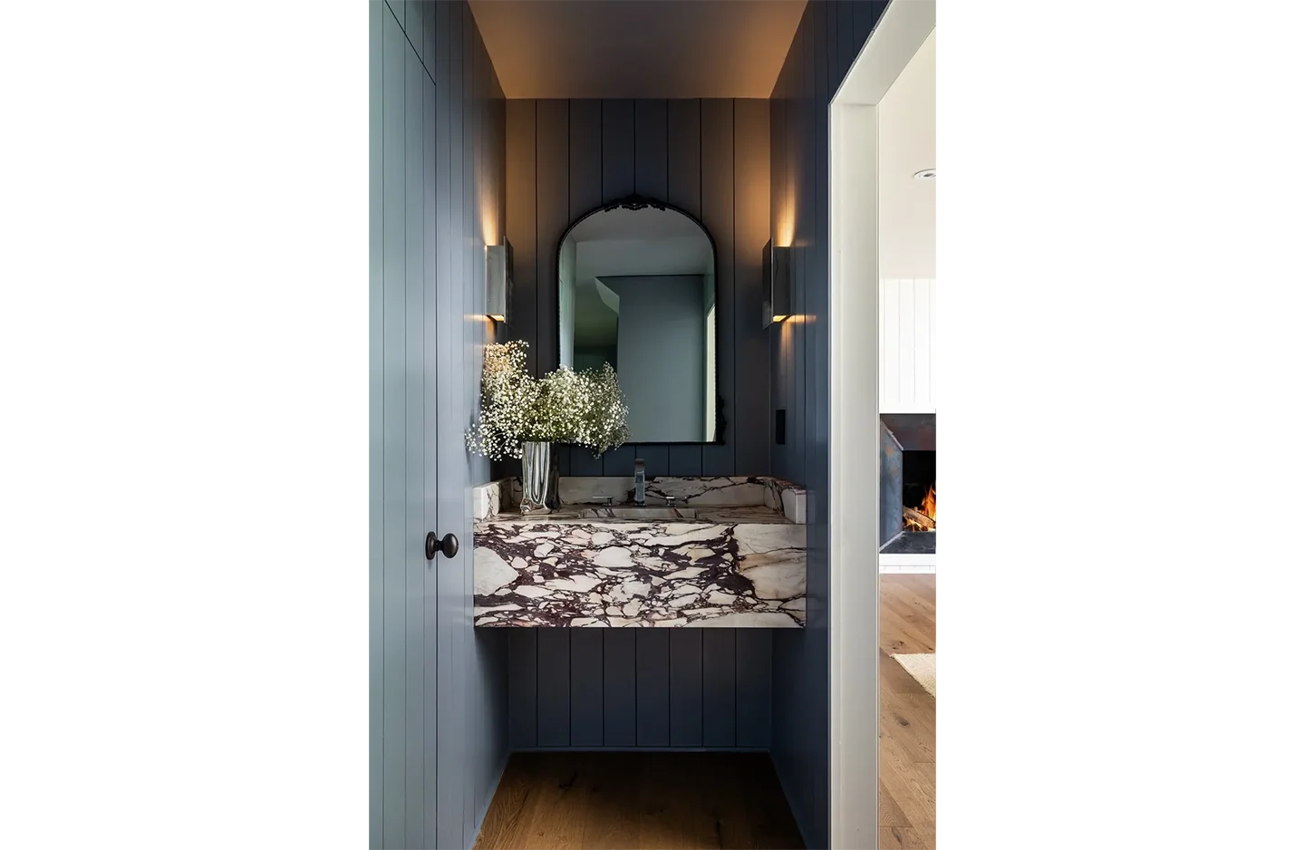 A bathroom with two sinks and a mirror.