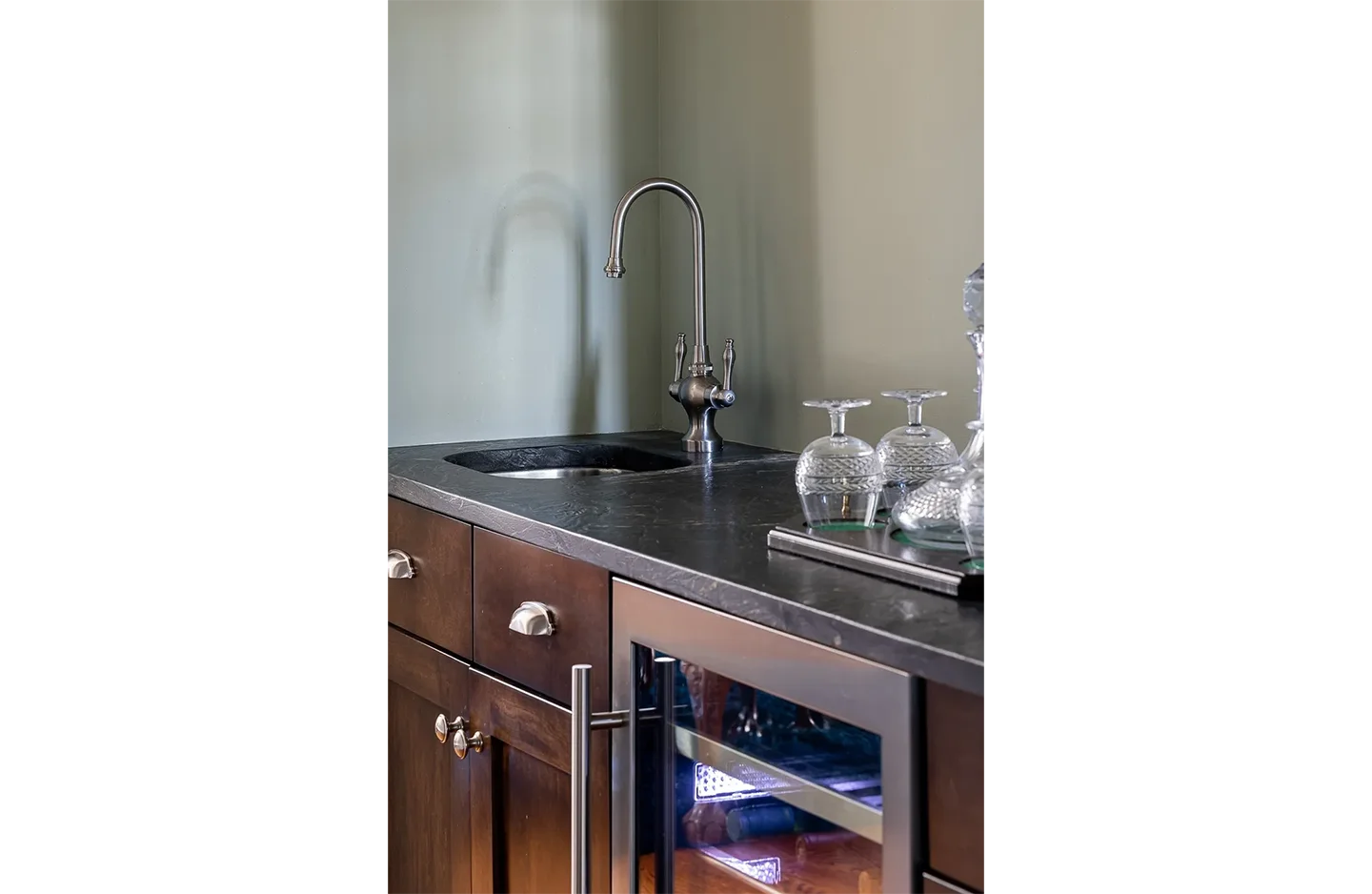 A kitchen with a sink and a counter