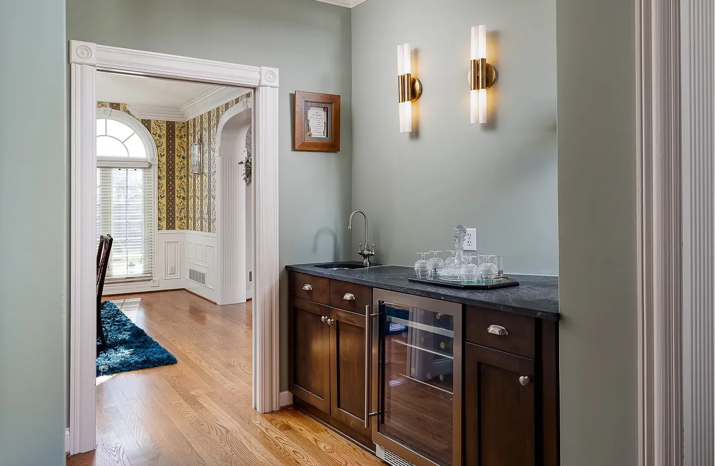 A kitchen with a sink and microwave in it