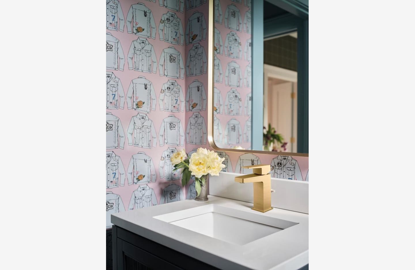 A bathroom with a sink and mirror in it