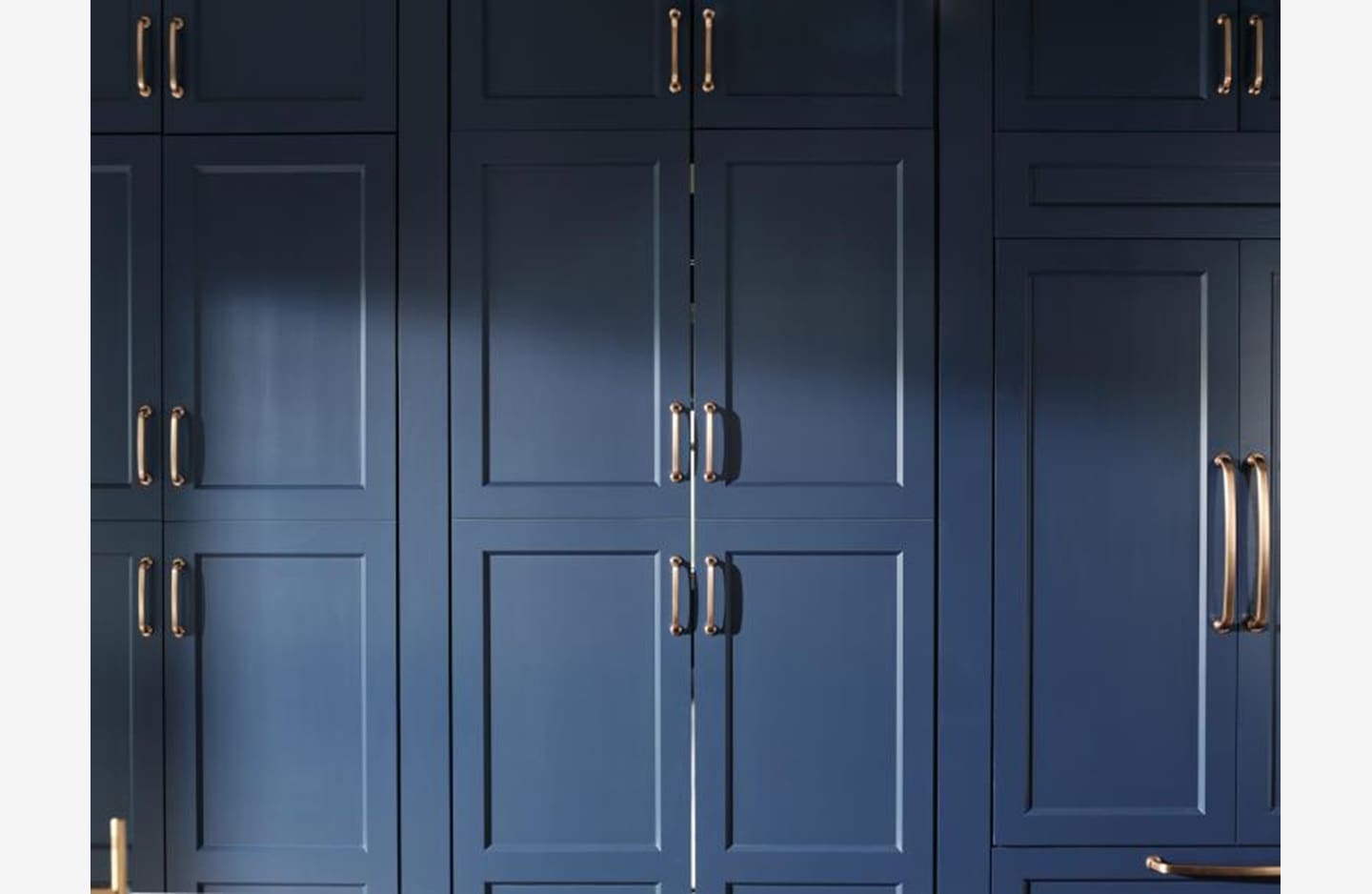 A blue closet with two doors and a metal handle.