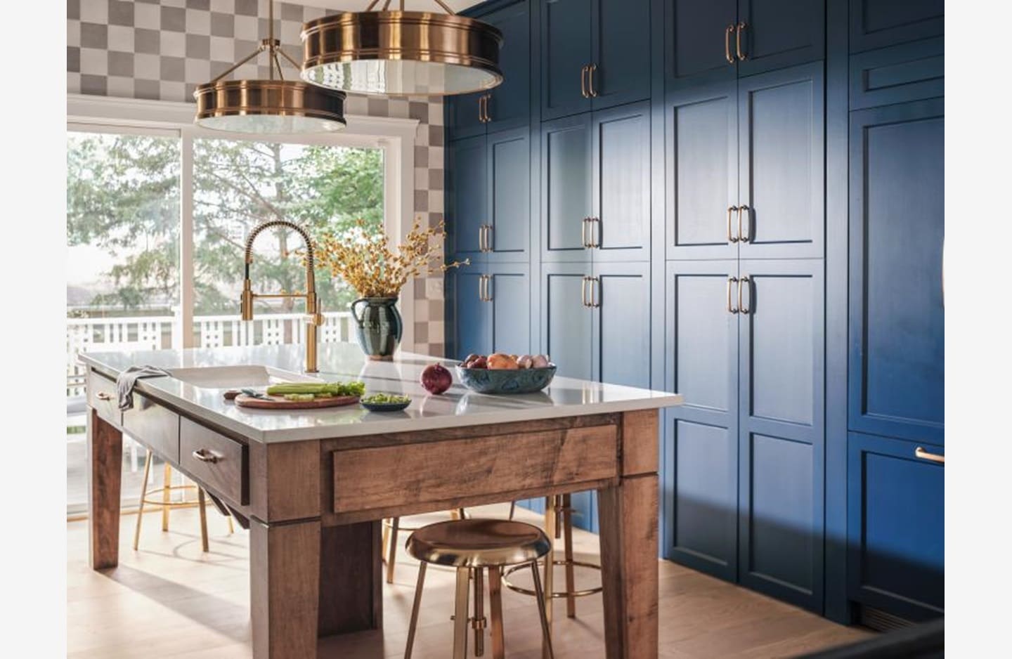 A kitchen with blue cabinets and a table